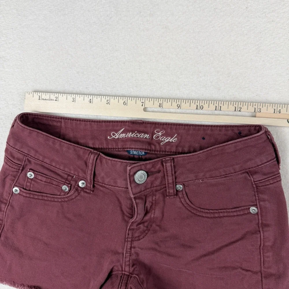 American Eagle Stretch Denim Shorts Burgundy Maroon Frayed Hem Size 0 Low Rise